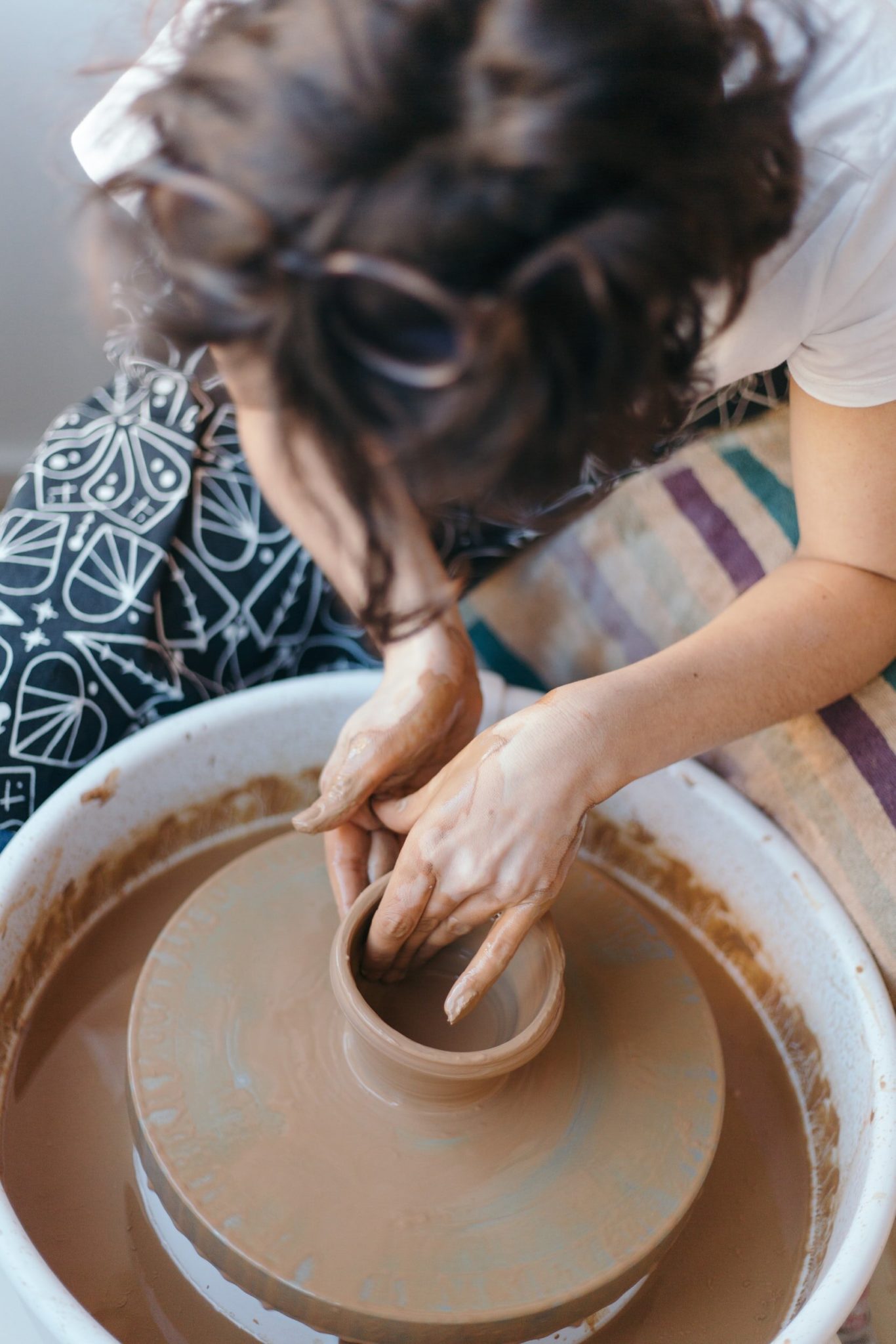 Female therapist practicing self-care strategies through artistic expression. As a therapist caring for your self is important. Working with an online therapist in Ohio and Kentucky can help you learn and implement your self-care strategies.