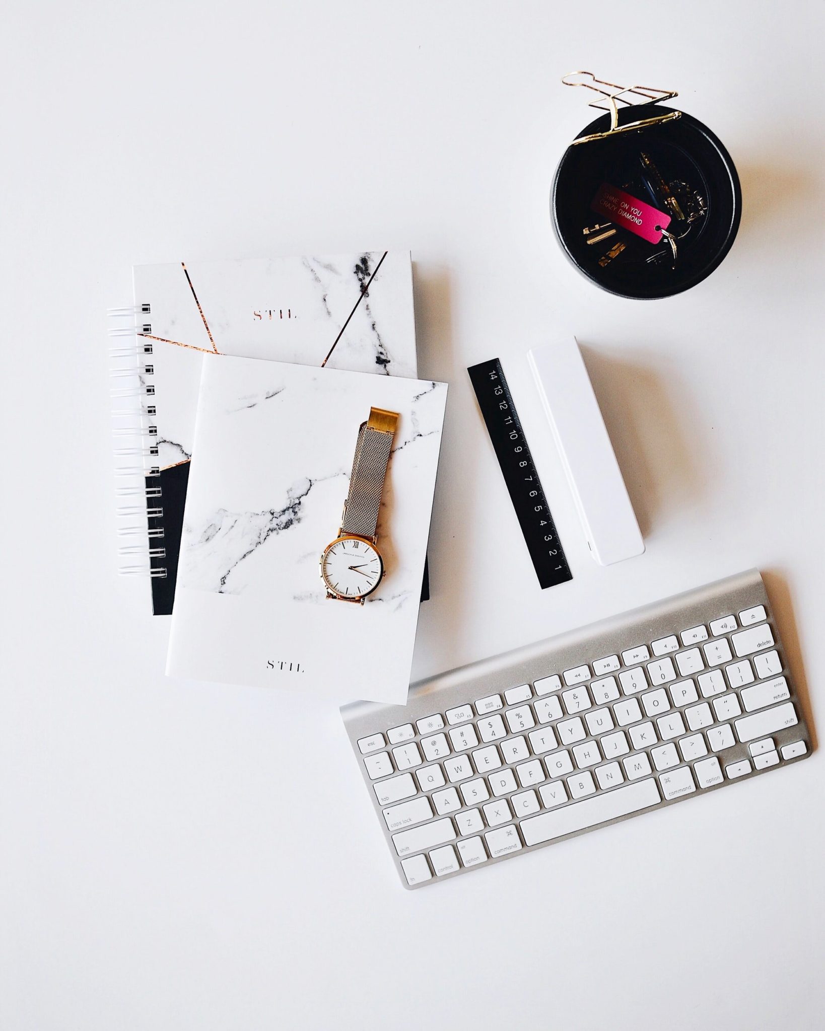 Desk with notebooks and office materials. Focusing on helping othe people manage their trauma can lead to secondary trauma for t he therapist. Its important to practice self-care strategies with an online therapist in Ohio.