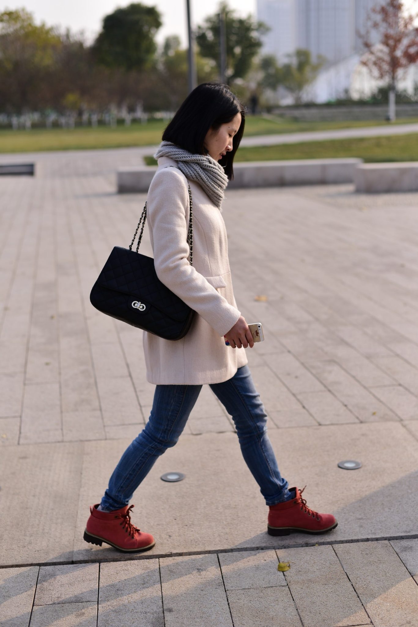 Professional therapist walking purposefully down the street. Trauma therapists need self-care as well. Work with an online therapist in Ohio and Kentucky can help you implement self-care strategies to care for your own mental health.