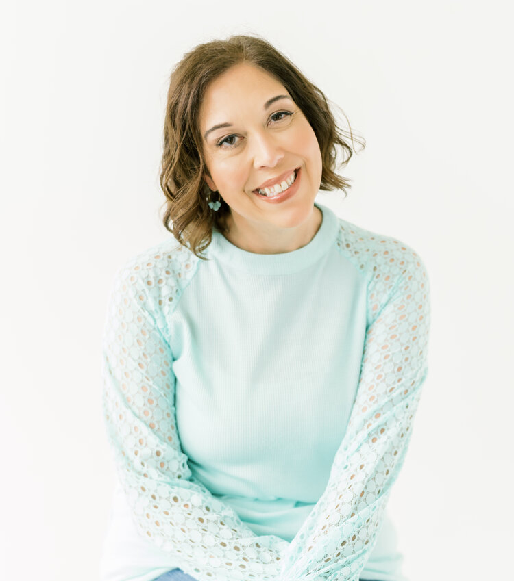 A picture of Christina in a mint green shirt. Christina is a skilled PTSD therapist in Ohio, working with a wide variety of trauma related issues.