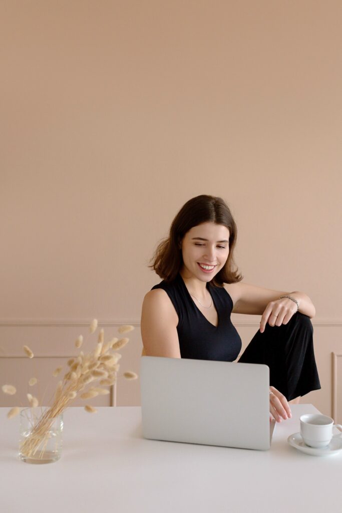 A woman works with an online trauma therapist at her home. 