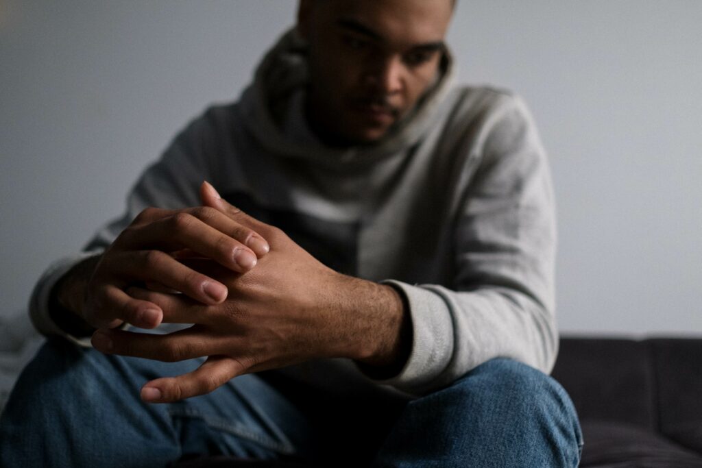 A man attempts to deal with his grief after losing a loved one to suicide. Survivors guilt can be crippling. Reach out to a trained Trauma Therapist in Ohio to get the support you need to process your grief and loss.