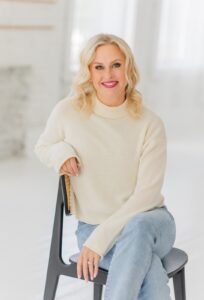 A professional headshot of a compassionate PTSD therapist in Ohio. This is Jenn, the founder of Thrive Therapy Clinic who offers trauma therapy Cincinnati and online therapy in Kentucky. Search for how a ptsd therapist in Ohio can offer support today.