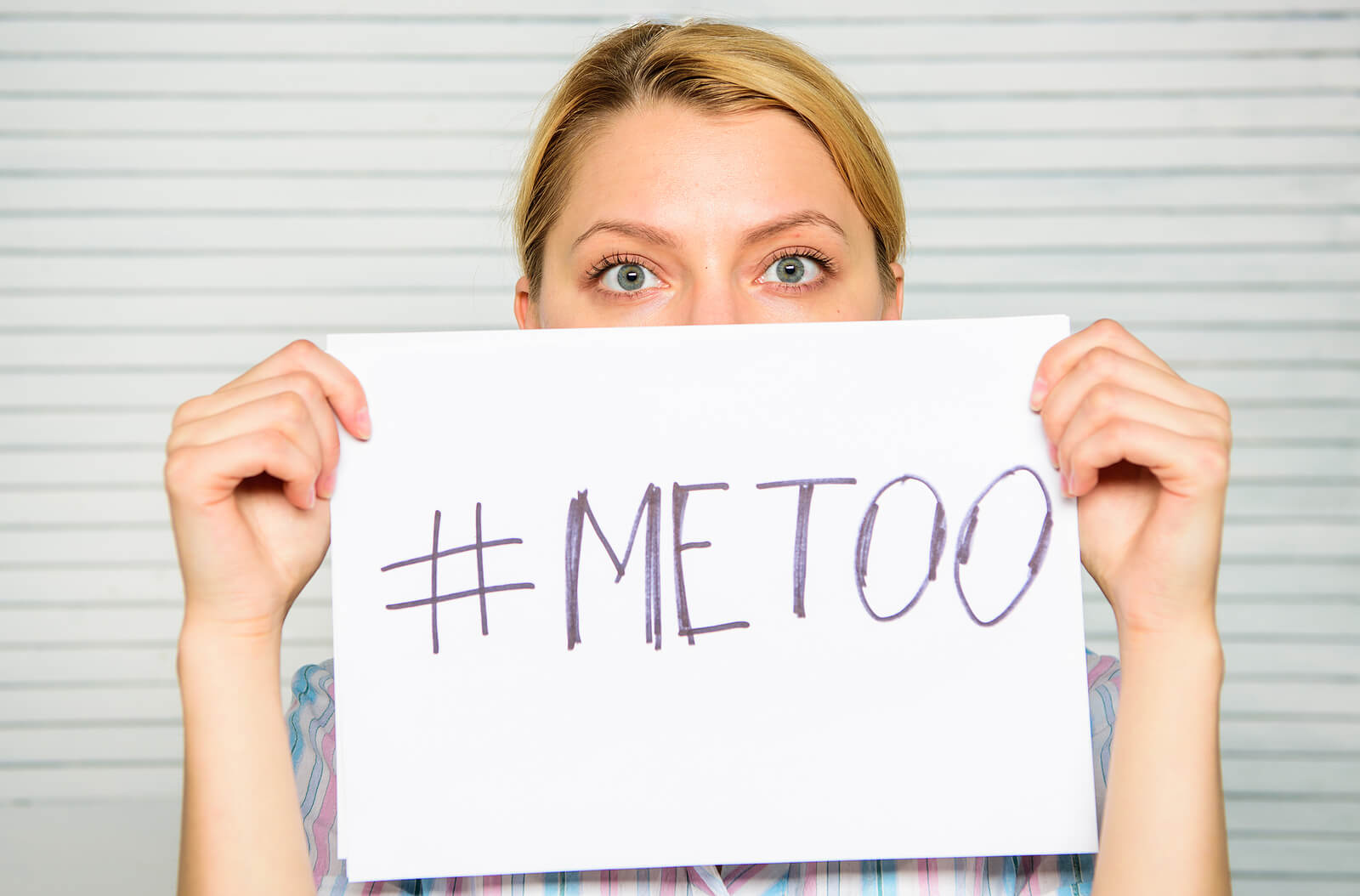 A woman holds a “#MeToo” sign in front of her face, symbolizing the courage it takes to speak up and be believed. For a sexual assault survivor in ohio, this image reflects the desire for safety, validation, and justice. It also connects to the healing journey available through therapy for sexual assault in ohio and compassionate therapy for sexual assault survivors.