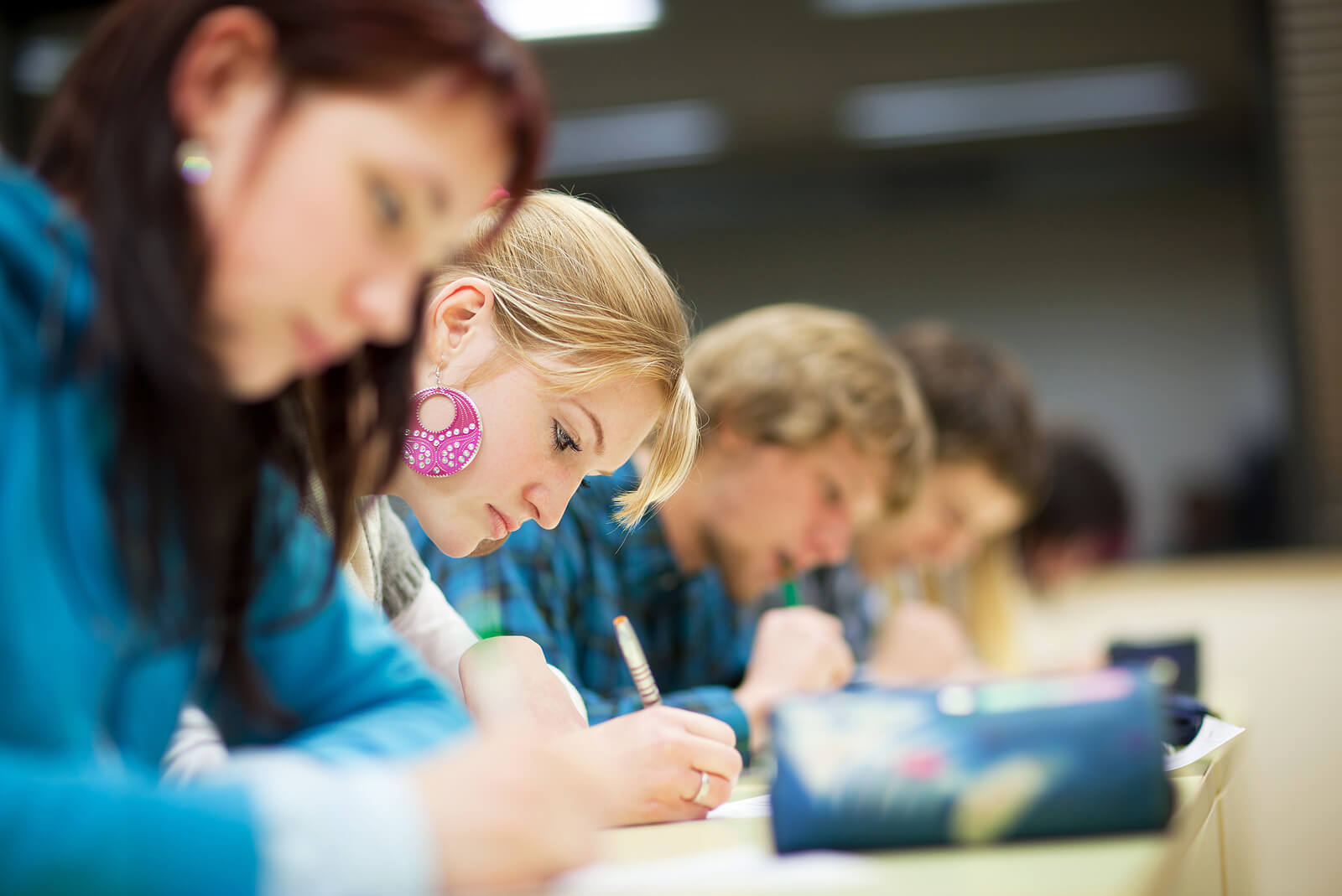 A row of college students sit focused in a classroom, writing notes during a lecture. For a sexual assault survivor in Ohio, simply returning to a classroom setting can feel overwhelming when the system meant to protect them has fallen short. Therapy for sexual assault in Ohio can help survivors reclaim their sense of safety and focus in the spaces where they deserve to feel secure.