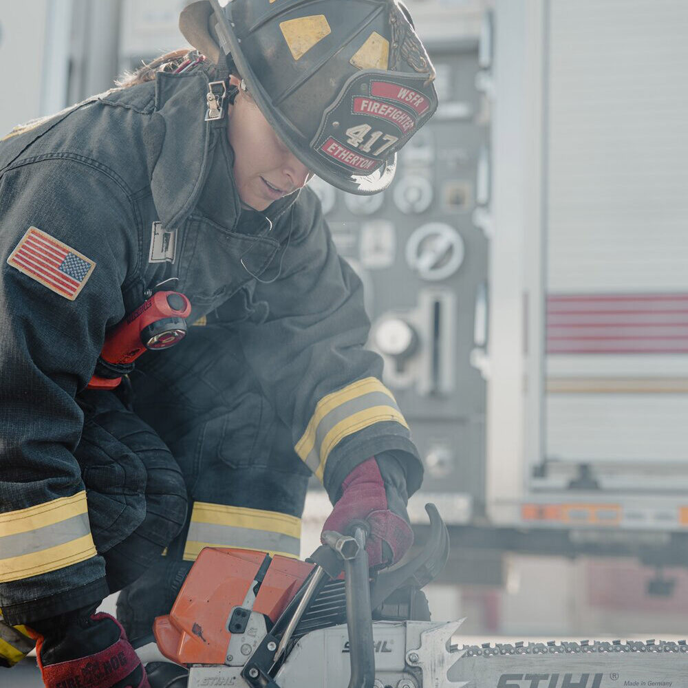 Female firefighter working at the scene of an accident representing the unique set of challenges faced by first responders on a daily basis. Therapy for first responders can help you process secondary trauma effectively. Learn more here.